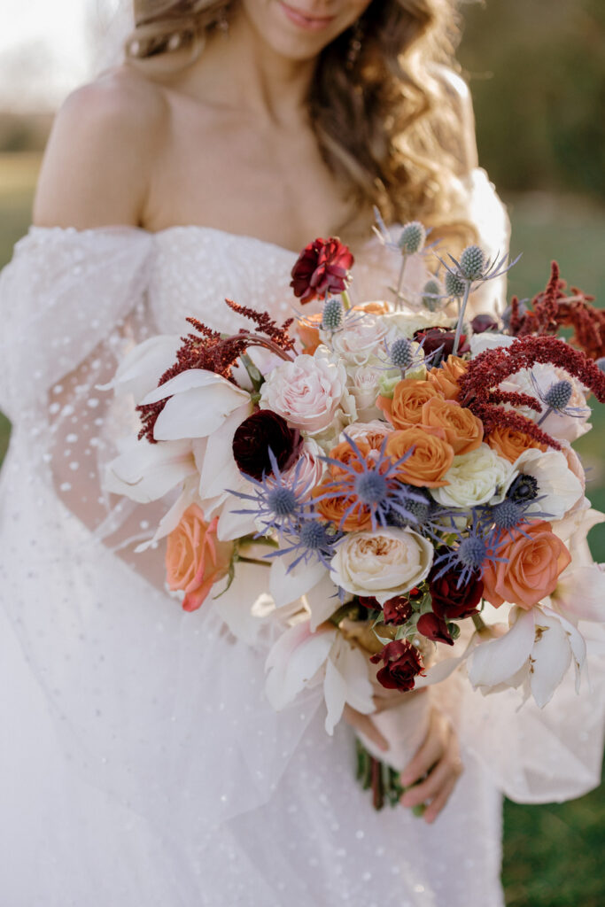 A close photo of the bride holding the bouquet.