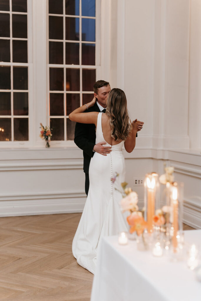 A bride and groom sharing a first dance at the wedding reception