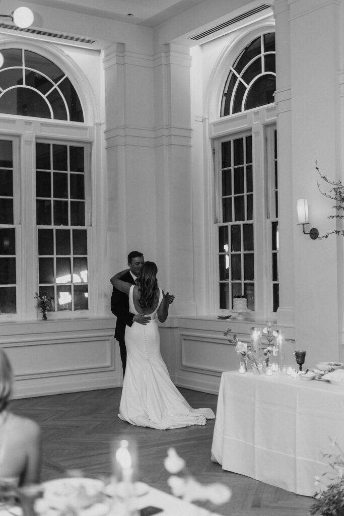 A bride and groom sharing a first dance at the wedding reception