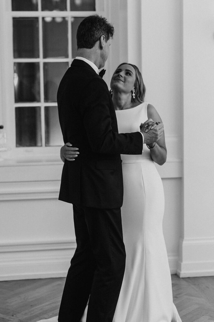 A bride and her father sharing a father daughter dance at the wedding reception