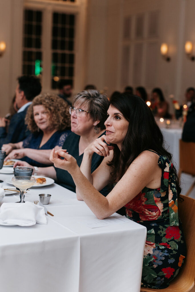 Wedding guests talking with each other at the wedding reception